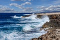Big waves break on the rocky shore on the mediterranean sea.Cyprus Royalty Free Stock Photo