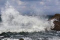 Big waves breaking on shore - wave splashing on rock Royalty Free Stock Photo