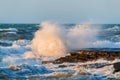 Big waves crash against coastal cliffs. Sea storm Royalty Free Stock Photo