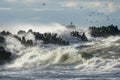 Big waves crash against the harbor breakwater concrete tetrapods during stormy weather Royalty Free Stock Photo