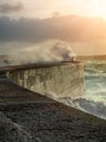 Big waves crushing on stone pier Royalty Free Stock Photo