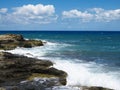 Big waves on rock coast blue sea and sky on Crete Royalty Free Stock Photo