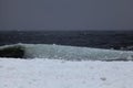 Big waves of slushy ice hit shore of Lake Superior Royalty Free Stock Photo