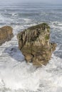Big waves smashing on worn cliff at Tasman sea shore, Punakaiki, West Coast, New Zealand
