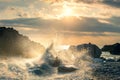 Big waves splash up to the sky with sun. Sunset at Sea. Storm. Seascape Royalty Free Stock Photo