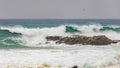 Big waves splashing on a rock in a spanish coastal, near the town Palamos