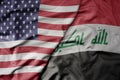 big waving colorful flag of united states of america and national flag of iraq Royalty Free Stock Photo