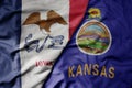 big waving colorful national flag of kansas state and flag of iowa state