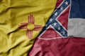 big waving colorful national flag of mississippi state and flag of new mexico state Royalty Free Stock Photo