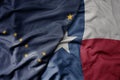 big waving colorful national flag of texas state and flag of alaska state Royalty Free Stock Photo