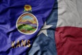 big waving colorful national flag of texas state and flag of kansas state Royalty Free Stock Photo