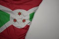 big waving national colorful flag of burundi on the gray background Royalty Free Stock Photo