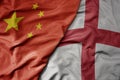 big waving national colorful flag of china and national flag of england Royalty Free Stock Photo