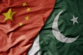 big waving national colorful flag of china and national flag of pakistan