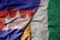 big waving national colorful flag of cote divoire and national flag of cambodia