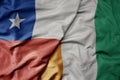 big waving national colorful flag of cote divoire and national flag of chile