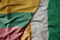 big waving national colorful flag of cote divoire and national flag of lithuania