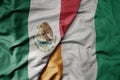 big waving national colorful flag of cote divoire and national flag of mexico