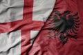 big waving national colorful flag of england and national flag of albania Royalty Free Stock Photo