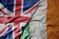 big waving national colorful flag of great britain and national flag of ireland Royalty Free Stock Photo