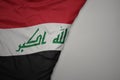 big waving national colorful flag of iraq on the gray background Royalty Free Stock Photo