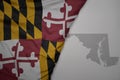 big waving national colorful flag and map of maryland state on the gray background Royalty Free Stock Photo