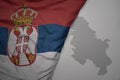 big waving national colorful flag and map of serbia on the gray background Royalty Free Stock Photo