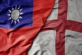 big waving national colorful flag of taiwan and national flag of england Royalty Free Stock Photo