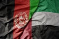big waving realistic national colorful flag of afghanistan and national flag of united arab emirates
