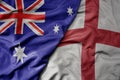 big waving realistic national colorful flag of australia and national flag of england