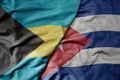 big waving realistic national colorful flag of bahamas and national flag of cuba Royalty Free Stock Photo