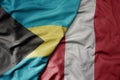 big waving realistic national colorful flag of bahamas and national flag of peru Royalty Free Stock Photo