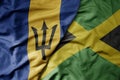 big waving realistic national colorful flag of barbados and national flag of jamaica Royalty Free Stock Photo