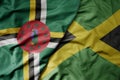 big waving realistic national colorful flag of dominica and national flag of jamaica Royalty Free Stock Photo