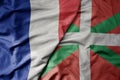 big waving realistic national colorful flag of france and national flag of basque country Royalty Free Stock Photo