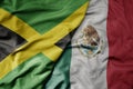 big waving realistic national colorful flag of jamaica and national flag of mexico Royalty Free Stock Photo