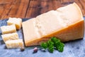 Big wedge of parmigiano-reggiano parmesan hard Italian cheese made from cow milk or Grana Padano Royalty Free Stock Photo