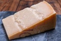 Big wedge of parmigiano-reggiano parmesan hard Italian cheese made from cow milk or Grana Padano Royalty Free Stock Photo