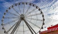 Big wheel at a fair festival with blue sky