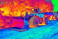 Big wheel loader machine unloading rocks in the open mine Royalty Free Stock Photo