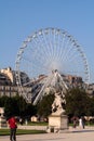 Big wheel and statue Royalty Free Stock Photo