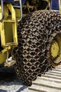 Excavator wheel with anti-slip chain , Big wheels with anti-slip chains Royalty Free Stock Photo