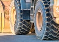 Big wheels tires of an excavator. Excavator loader construction machinery Royalty Free Stock Photo