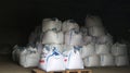 Big white bags in the warehouse - products and fertilizers