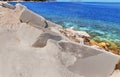 Big white blocks of raw marble and sea in Greece