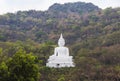 Big white buddha statue sitting on the mountain at Nakhon Ratchasima Thailand Royalty Free Stock Photo