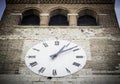 Big white clock on the facade of the bell tower Royalty Free Stock Photo