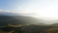 Big white clouds over green hills and mountains Royalty Free Stock Photo