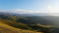 Big white clouds over green hills and mountains Royalty Free Stock Photo