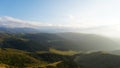 Big white clouds over green hills and mountains Royalty Free Stock Photo